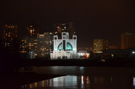 Kiev night Catholic church panorama on Dniper 