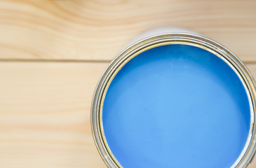 A tin can of blue paint