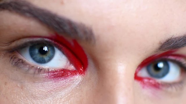 Close-up of beautiful female eyes with bright make-up