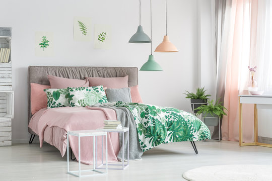 Pastel beddings on stylish bed