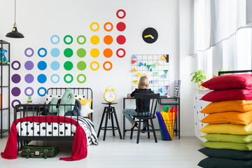 Kid in colorful bedroom