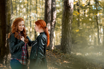 Red-haired girls in the forest