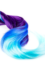 Curly voluminous shiny purple color hair on a white background