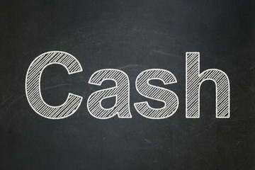 Banking concept: Cash on chalkboard background