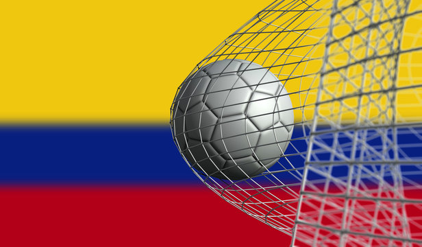 Soccer ball scores a goal in a net against Colombia flag. 3D Rendering
