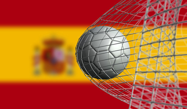 Soccer ball scores a goal in a net against Spain flag. 3D Rendering