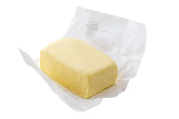 Schilderijen op glas Close up of open pack of margarine or vegetarian butter on white backgraund. © JPC-PROD
