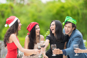 Red wine Christmas party concept. Happy new year coming soon.People celebrating happy drinks with friends