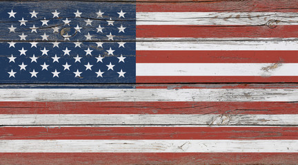 Old vintage American US flag over white wood