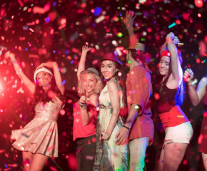 people throwing confetti and drinking.