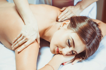 Obraz na płótnie Canvas a back massage in the salon