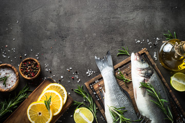 Fresh fish seabass on black.