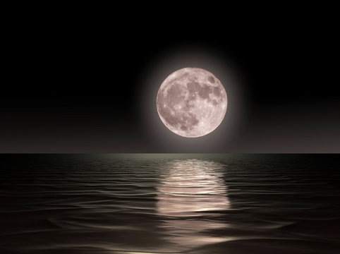 Red moon rising on the ocean. © CLAUDIO
