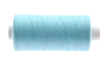 A colorful spool with threads often used in tailoring and is an indispensable element of this profession.
