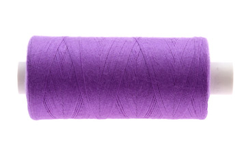 A colorful spool with threads often used in tailoring and is an indispensable element of this profession.
