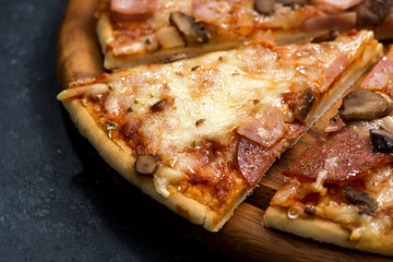 Pizza with cheese and sausage, closeup