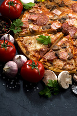 pizza with sausage and cheese and ingredients, vertical