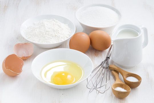 ingredients for baking on a white wooden table