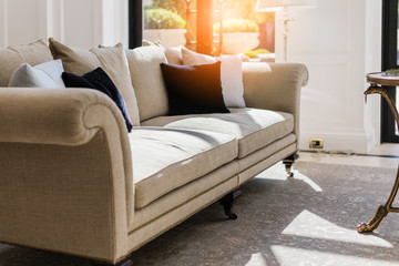 contemporary interior of Living room with part of sofa in sunny day and white curtain interior design background concept