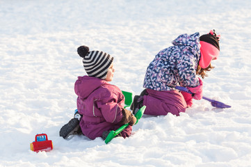Children play on the snow