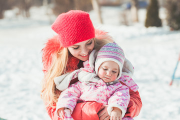 Portrait of mother and daughter in winter