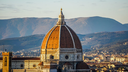 Fototapeta premium Sun setting over Florence and the Florence Cathedral, Santa Maria del Fiore in Florence, Italy