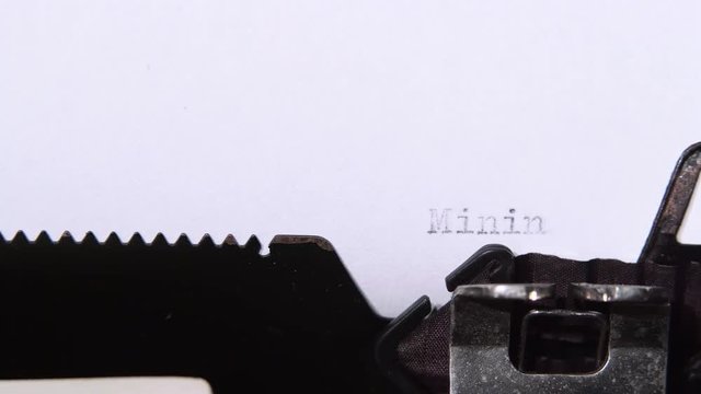 Word is mining a piece of paper. Close up