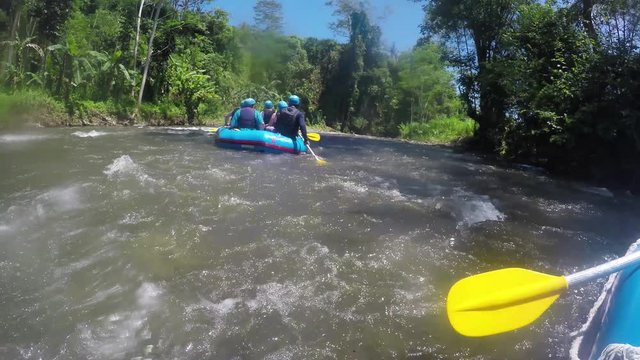 Rafting in the canyon on Balis mountain river. Group of traveler in the inflatable rafting on the river, extreme and fun sport