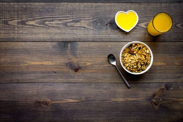 Healthy breakfast. Porridge and fresh juice. Dark wooden background top view copyspace