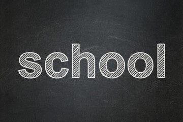Obraz premium Studying concept: text School on Black chalkboard background