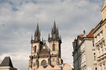 Obraz premium Church of Our Lady Before Tyn in Old Town Square, Prague. Church of Our Lady Before Tyn overlooking Old Town Square, warm natural light from the sun.