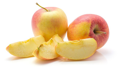 Three apple slices (Evelina variety) and two whole red yellow isolated on white background.