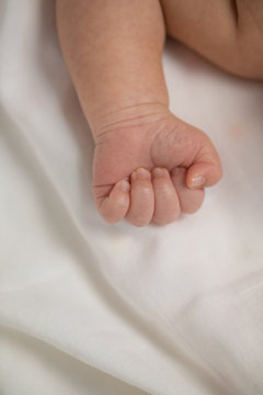 Asian new born baby boy`s hand.