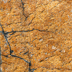 texture of brown stone or marble with vertical and horizontal cracks