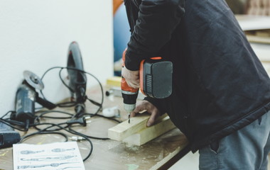 Senior craftsman working on woodwork