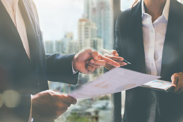 Business adviser analyzing financial figures denoting the progress Internal Revenue Service...