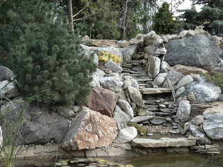 Naklejka na ściany i meble The fountain is a stylized mountain stream