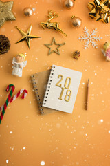 Christmas holiday background with gold ornaments and decorations. Merry christmas and happy new year greeting card with copy space. Christmas celebration holiday background.