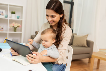mother student with baby and tablet pc at home
