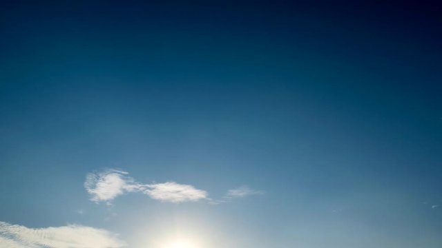 Beautiful blue cloudscape time lapse ending on sunset 