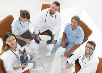 Fototapeta premium medical staff discussing current issues,sitting behind a Desk