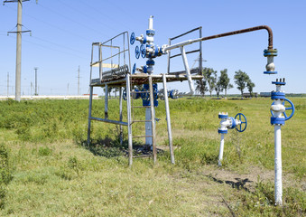 Fototapeta na wymiar Well for water injection into the reservoir. Maintaining reservoir pressure. Oil production. Well for maintenance of reservoir pressure. Pumping water in layer.