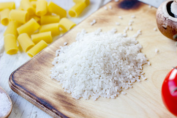 Kitchen board with a dry raw rice