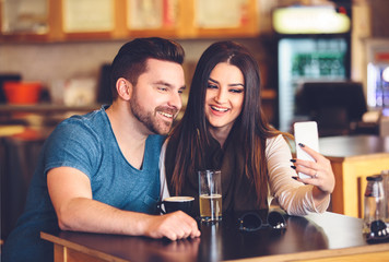 Happy couple taking selfie