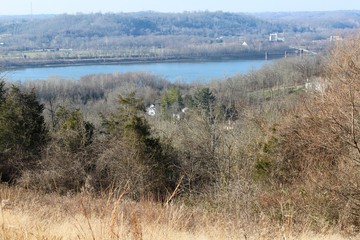 The houses on the riverbank of the flowing river.