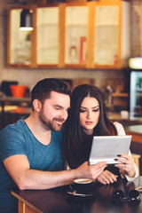 Happy young couple in cafe