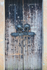 Old wooden door in the Chinese temple. The door is locked