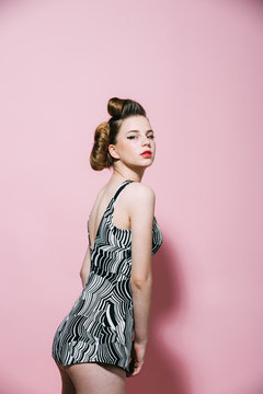 Woman with retro hair and fashionable makeup, pinup.