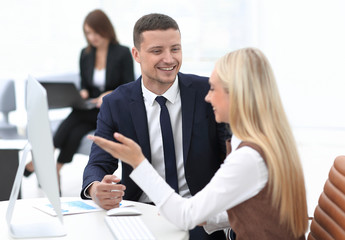 Fototapeta premium Manager talking with a colleague at the workplace