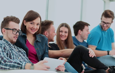 Fototapeta na wymiar girl University student with friends sitting in the lobby and ta
